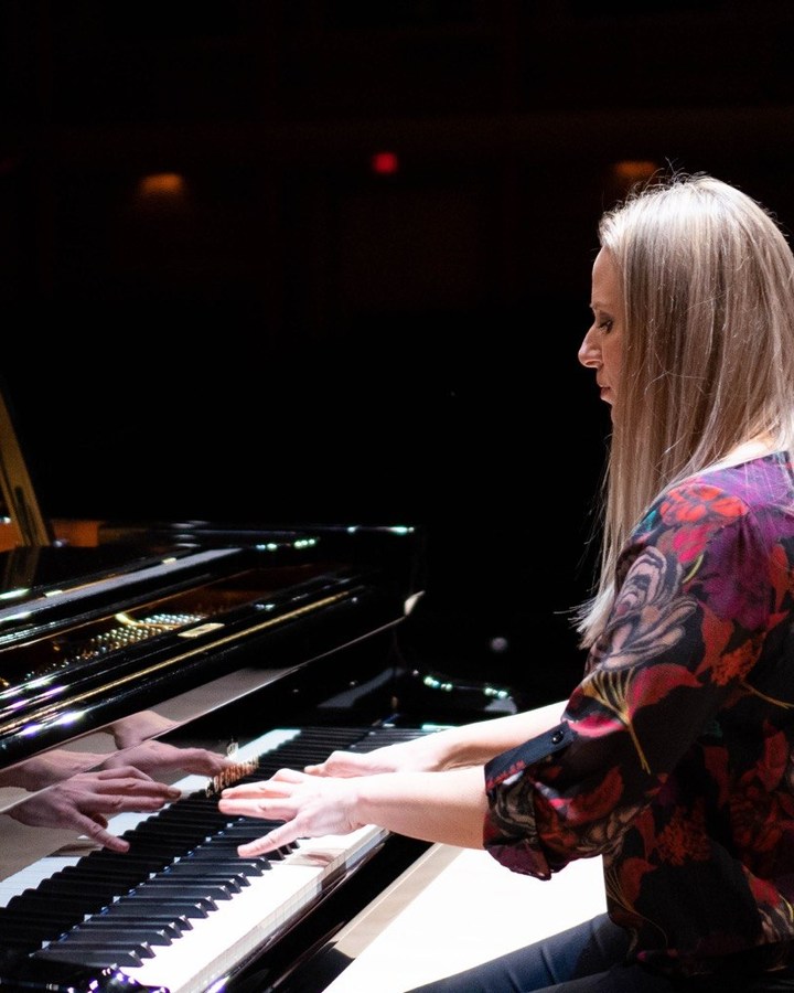Dr. Lana Henchell performing at a C. Bechstein grand piano.